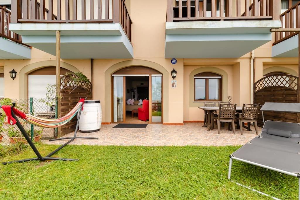 Casa De Las Flores - Apartamento Con Jardin Privado Frente A La Playa De Комилас Екстериор снимка
